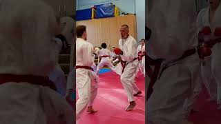 Sensei Jacek Lipinski and athlete Jakub completing a drill at kumite squad training