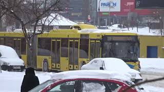 MAZ 215, a lot of snow. Fully low-floor articulated bus with engine inside the cabin.