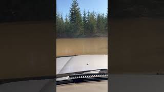 Land Cruiser 80 series driving through deep water