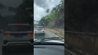 Truck reverses to escape landslide on mountainside