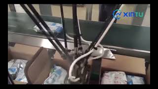 Horizontal delta robot pickup and place case packer for bagged milk powder|Case packing machine