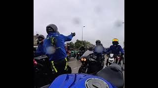 Biker hugs friend