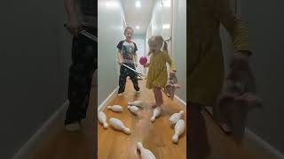 Leon and Natalie attack the bowling pins