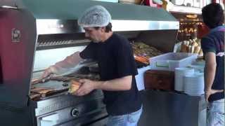 man selling balik ekmek (fish sandiwches) in istanbul