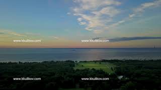 Panoramic view from the drone of the coast of the Gulf of Finland during a sunset near the park