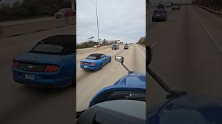 convertible mustang squeezing by