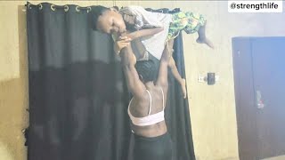 strong African woman lift and carry session