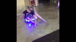 Girl hoverboards into wall