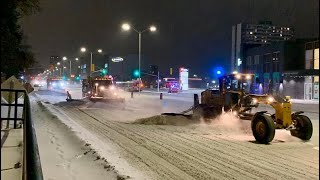 Graders and snow plows plowing snow Januar