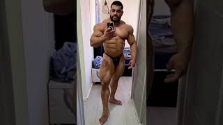 Muscle bull Sahar Kazes in black posers looking like a god