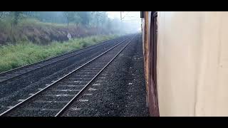 Freight train crossing 12133 Manglore Express at Nandgaon Station #KonkanRailway