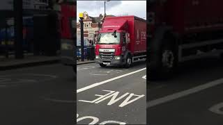 Two DAF trucks. DAF LF truck and a DAF LF 12 wheeler semi truck carrying a container