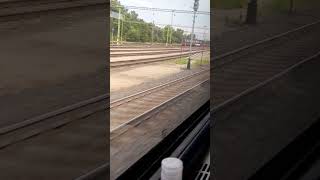 fast train coming and leaving besides us  arriving Tatabanya railwaystation pretty retro locomotive