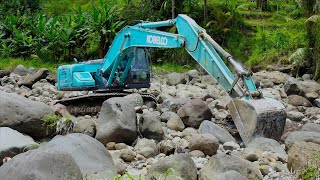 Kobelco SK200 Excavator Moving Rocks On The River