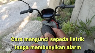 Cara mematikan alarm pada saat sepeda listrik terkunci.