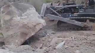 DOZER PUSHING MASSIVE BOULDER!!!!