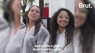 Teens painting a mural in Paris to share their thoughts about the Future of Education with GoStudent