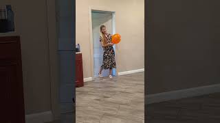 Funny dog finds an orange balloon