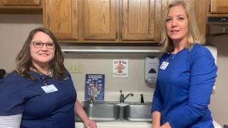 Renee Glesner and Beth Resch demonstrate proper hand washing technique.