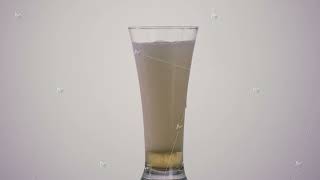 A hand of a drunk man pouring beer inside a long transparent glass and spilling it on the table