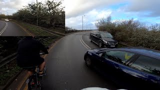 Impatient cars at Brent Cross, London. 2 on a blind corner. Oncoming car almost pushed off the road.