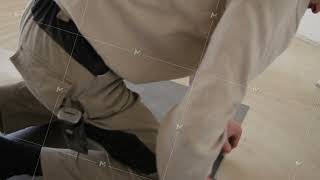 Repair, building, floor and people concept - close up of man installing flooring