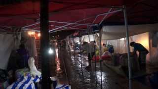 Walking through Luang Prabang Night Market in the rain