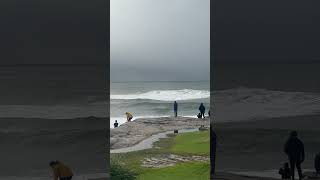 Surfers stuck out at sea