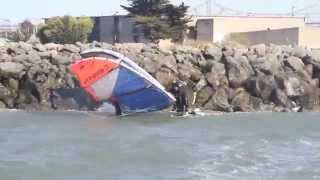 Kitesurfing self-rescue onto rocks