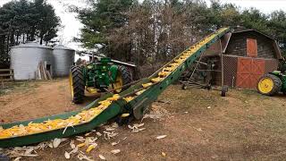 Filling corn crib with John Deere tractors and equipment!