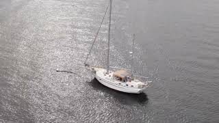 A sailboat moored in Battleship Cove