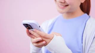 Woman Looking at Iphone 14 Screen - Free Stock Footage Download!