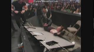 Kronik chokeslams Undertaker through table