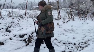 Hunting in the snowy mountains for food/