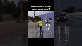 Worker makes traffic think puddle is deep 😂😂😂 | #shorts #funny #cars