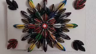 Mandala elaborado con chapas de botellas. Artesanía Nueva Tierra