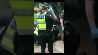 Australian Woman Cries for Help as Police Arrest Her for Protesting. Melbourne, Australia.