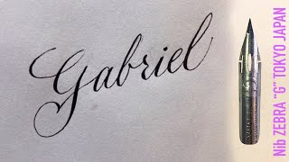 With a Japanese sharp pen, ZEBRA G, I write the name Gabriel in calligraphy handwriting.