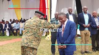 Brig.Gen.Felix Kulayigye prays for Brig.Gen.Charles Kisembo at his thanksgiving ceremony in Kahunge