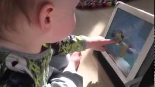 Villads (1 year) playing iPad with his own sounds..