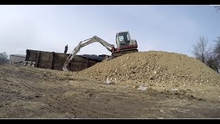 Clearing Scrap with an Excavator