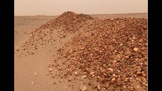 Inspecting the area where exploration has been done at a tenement in the Sahara Desert, Mauritania.