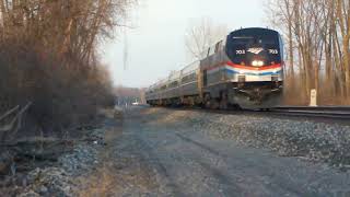 Amtrak with locomotive 703 heading west and a dark intermodal shot