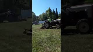 Fords cutting grass