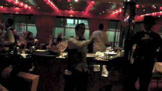 Waitstaff on the Carnival Dream cruise dance to a medley of Michael Jackson songs