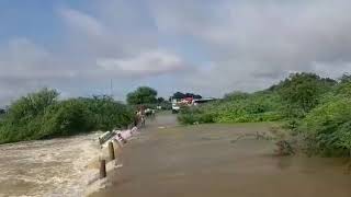 Car washed away as two men tried to cross an overflowing pond in Gooty, Anantapur