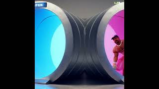 Masculine man gets pulled into Autocloset tunnel and emerges wearing pink dress and bow