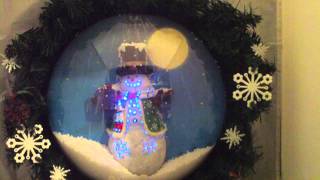 Animated lighted Musical Motion Activated Snowman Wreath