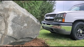 Pulling out a huge rock with my truck