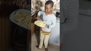 Is breakfast time and my 7 year  old son in the kitchen .